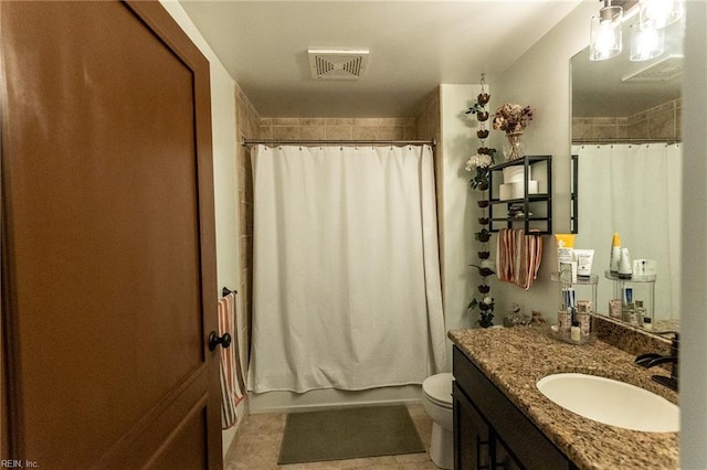 full bathroom featuring tile patterned floors, vanity, shower / tub combo, and toilet