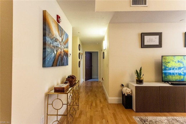 hall with light wood-type flooring