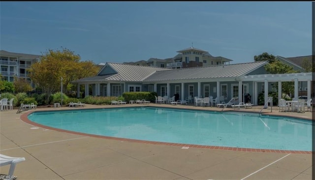 view of swimming pool with a patio area