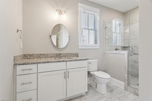 bathroom with vanity, toilet, and walk in shower