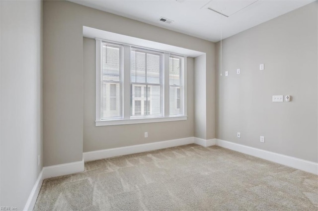 carpeted empty room with a wealth of natural light