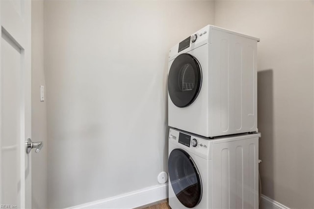 laundry room featuring stacked washer and clothes dryer