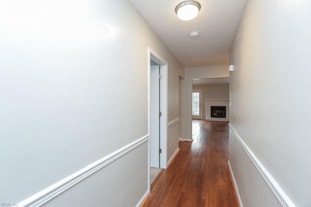 hallway featuring dark hardwood / wood-style floors