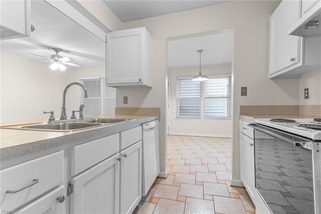 kitchen with white appliances, extractor fan, ceiling fan, sink, and white cabinets