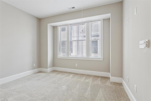 empty room with light colored carpet