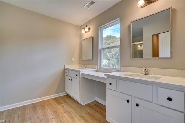 bathroom featuring vanity and hardwood / wood-style flooring