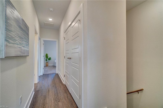 corridor with dark wood-type flooring