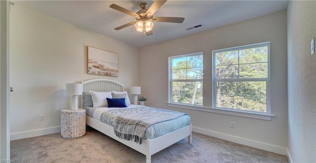 bedroom with ceiling fan and carpet floors