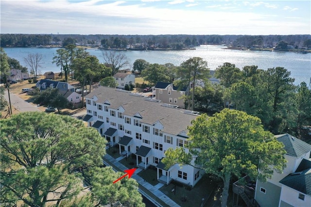 birds eye view of property with a water view