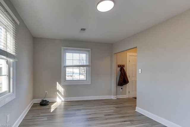 unfurnished room featuring light hardwood / wood-style floors