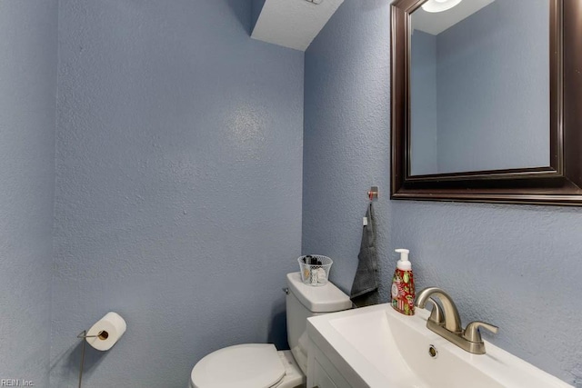 bathroom featuring sink and toilet