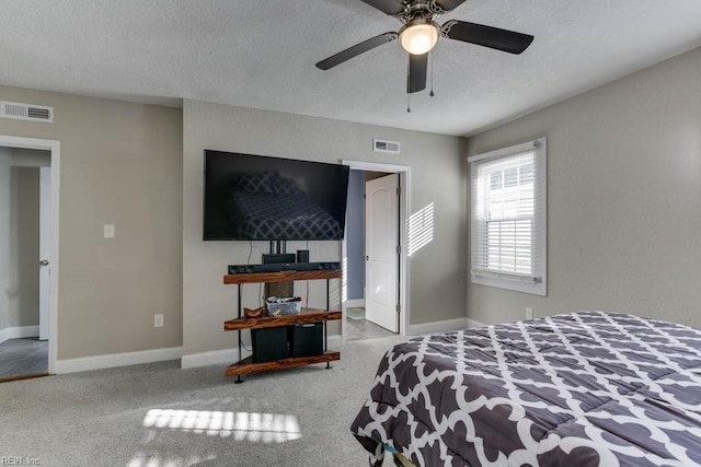 bedroom featuring ceiling fan and a textured ceiling