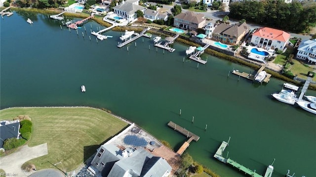 birds eye view of property featuring a water view