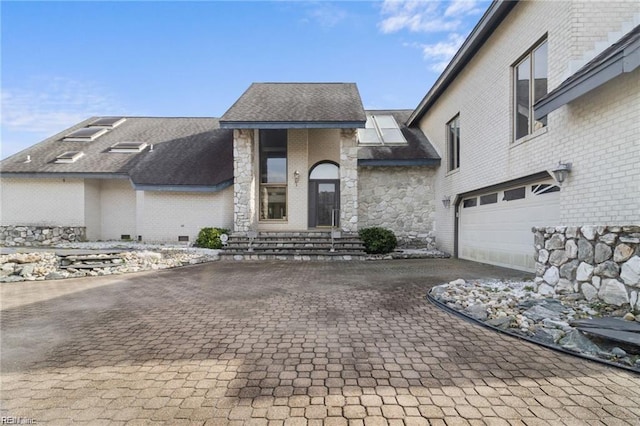 view of front of property with a garage