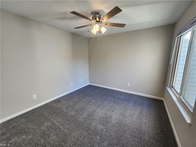 spare room featuring carpet flooring, ceiling fan, and plenty of natural light