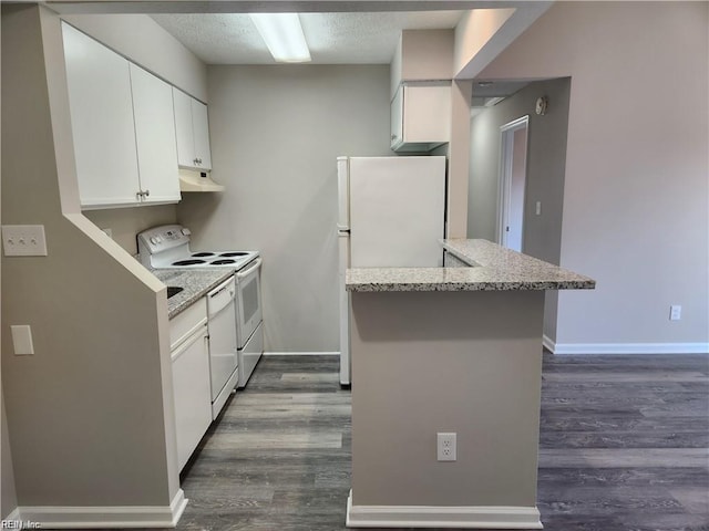 kitchen featuring white appliances, white cabinets, light stone counters, dark hardwood / wood-style flooring, and kitchen peninsula