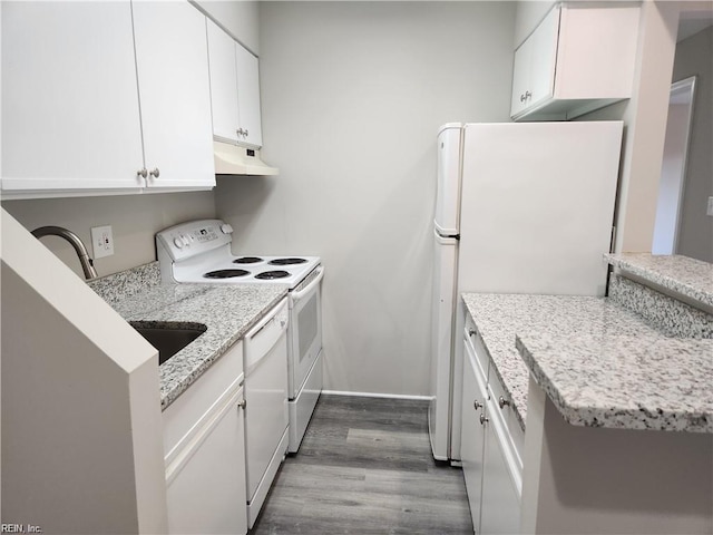 kitchen featuring white appliances, light hardwood / wood-style floors, white cabinetry, and light stone counters