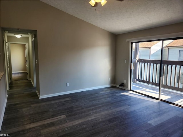 spare room with ceiling fan, dark hardwood / wood-style flooring, and a textured ceiling