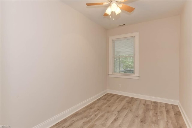 spare room with ceiling fan and light hardwood / wood-style floors