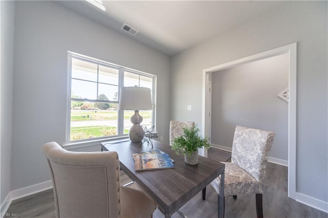 dining area with dark hardwood / wood-style floors