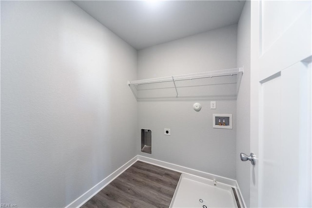 clothes washing area featuring electric dryer hookup, dark hardwood / wood-style flooring, gas dryer hookup, and hookup for a washing machine