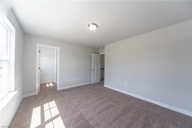 empty room featuring light colored carpet