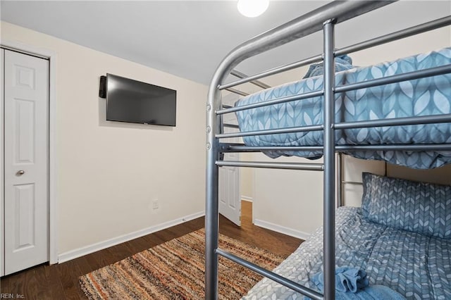 bedroom featuring dark hardwood / wood-style flooring