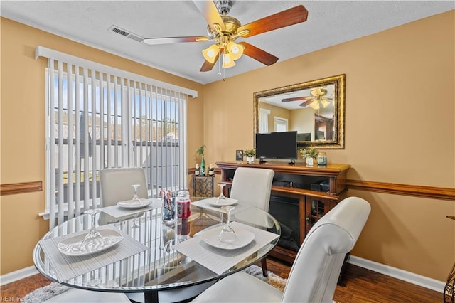 dining space with hardwood / wood-style flooring