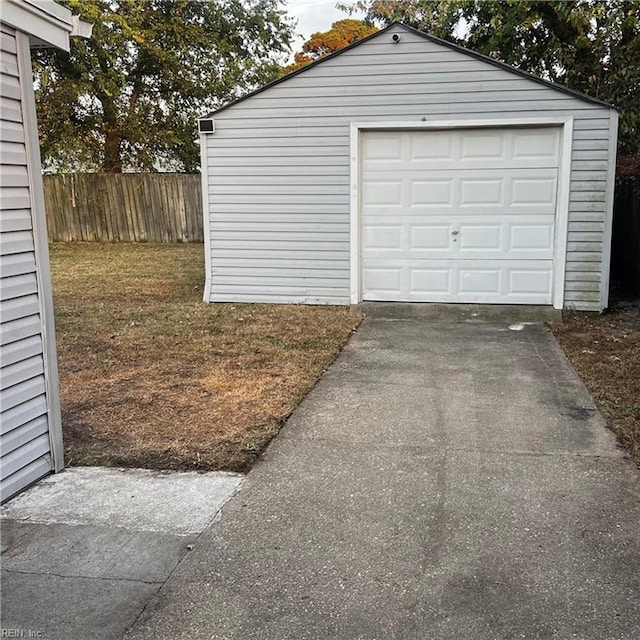 garage with a yard