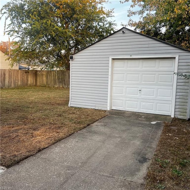 garage featuring a lawn