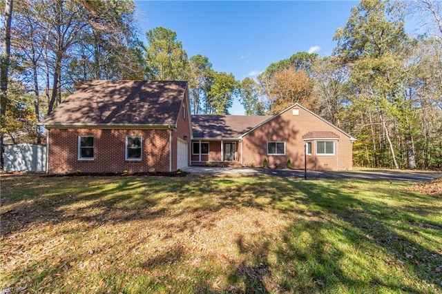 back of house with a yard