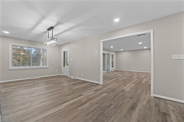 unfurnished room with hardwood / wood-style floors