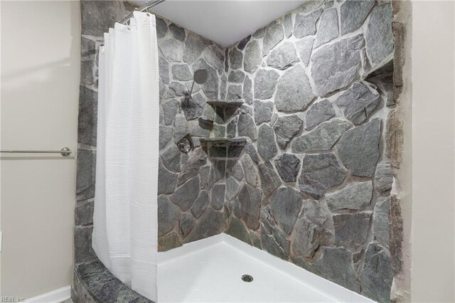 bathroom with a shower with shower curtain