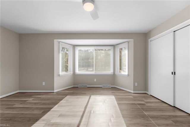 unfurnished bedroom with ceiling fan