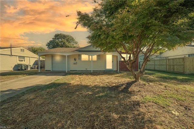 exterior space featuring a yard and a carport