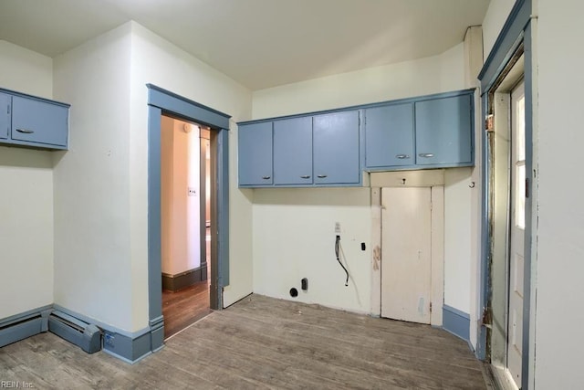 laundry area featuring dark wood-type flooring