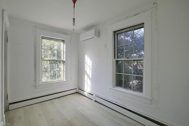 unfurnished dining area with light hardwood / wood-style floors and an AC wall unit