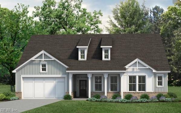 view of front facade featuring a front yard and a garage