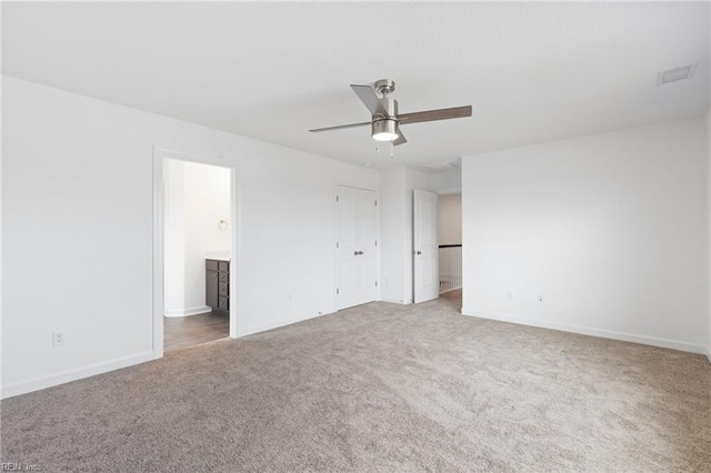 carpeted empty room with ceiling fan