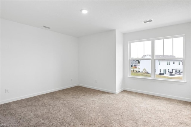 unfurnished room featuring carpet floors