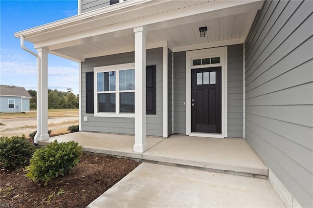 doorway to property with covered porch