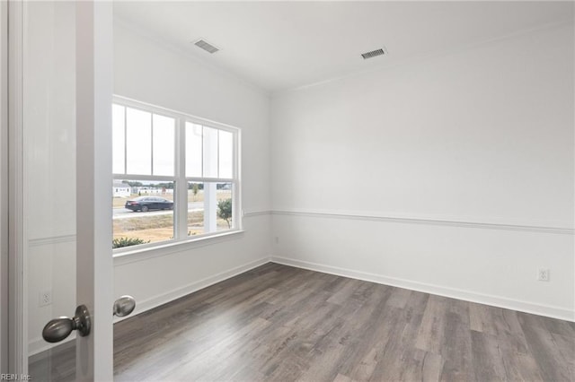 unfurnished room with wood-type flooring