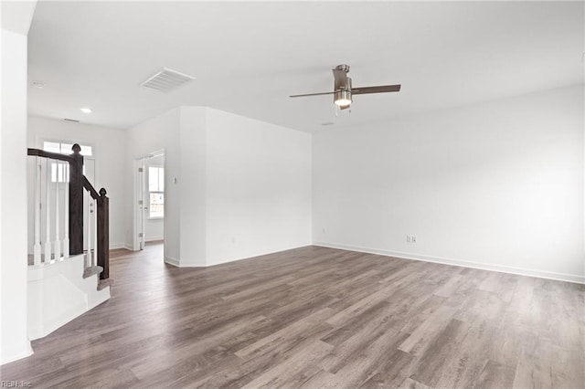 unfurnished living room with ceiling fan and hardwood / wood-style floors