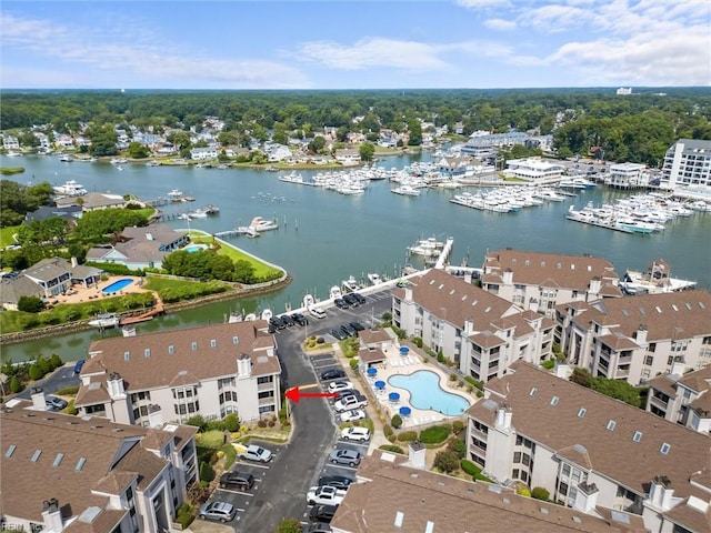 birds eye view of property with a water view