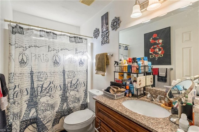 bathroom with vanity and toilet