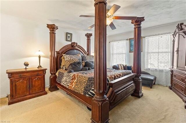 carpeted bedroom with ceiling fan