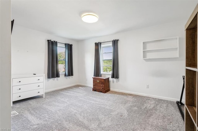 unfurnished bedroom featuring light colored carpet