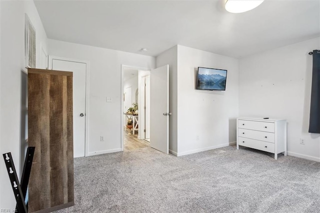 unfurnished bedroom featuring light colored carpet