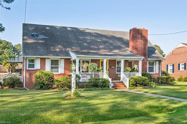 view of front facade with a front lawn and a porch