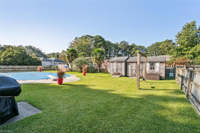 view of yard featuring a covered pool